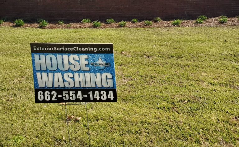 An Exterior Surface Cleaning house washing sign on someone's front lawn
