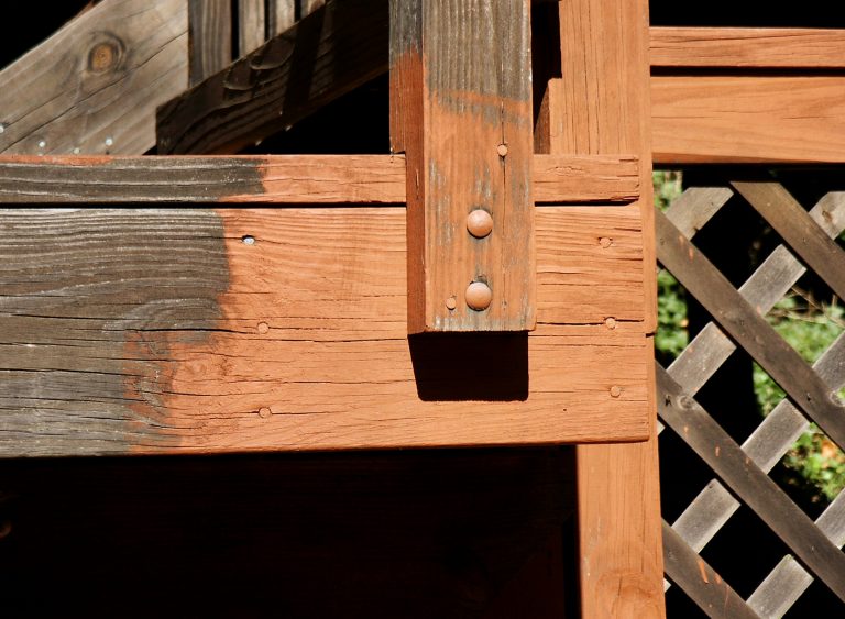 A closeup of a decaying and deteriorated deck